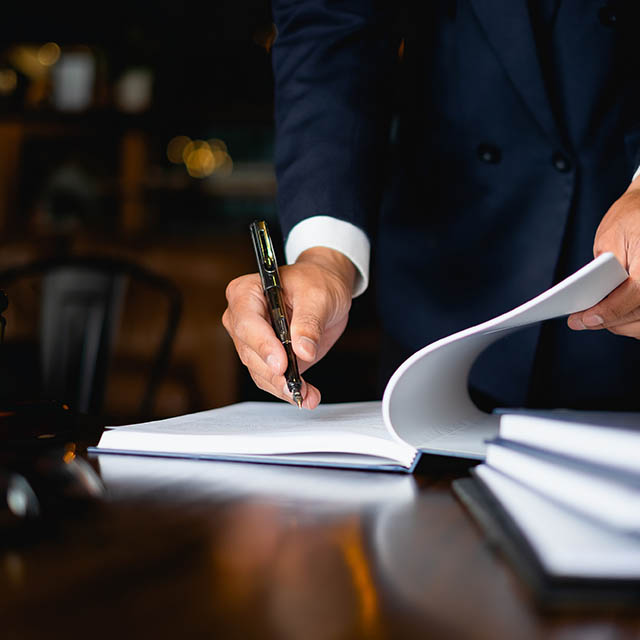 Lawyer at desk reviewing documents